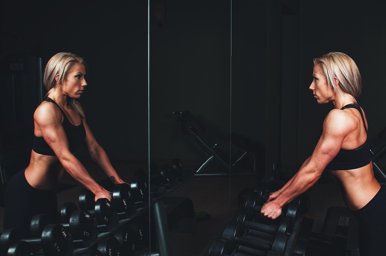 Basement home gym with workout equipment and mirrors